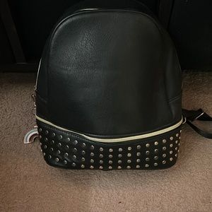 A backpack with a bottom zipper